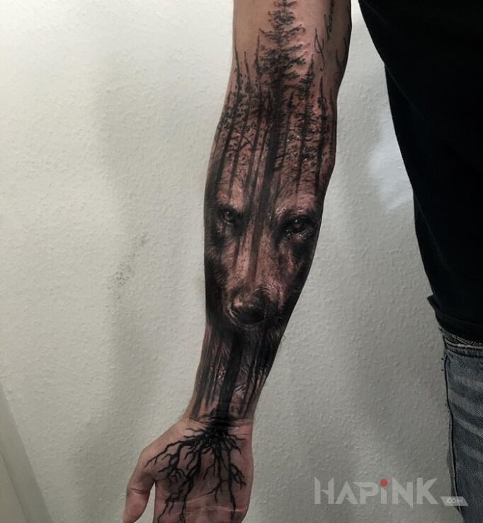 Tattoo Niedźwiedź in animals motif and realistic style on the forearm
