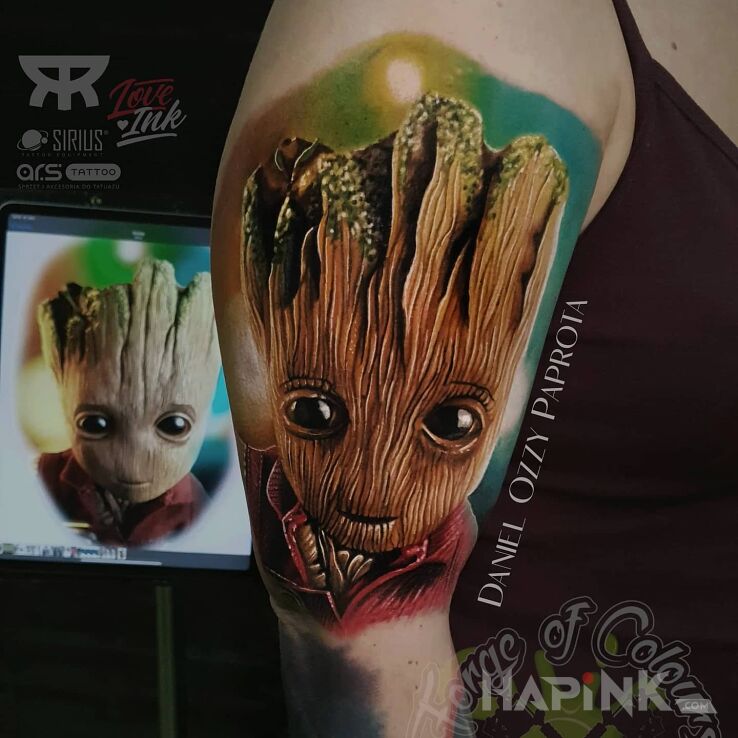 Tattoo Groot in characters motif and realistic style on the upper arm