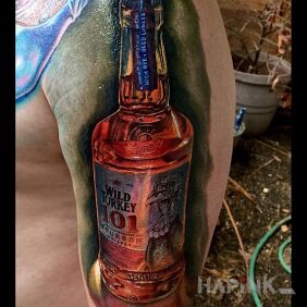 Tattoo Bottle of whiskey on the upper arm motif: 3D