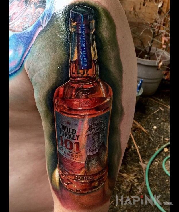 Tattoo Butla whiskey in 3D motif on the upper arm