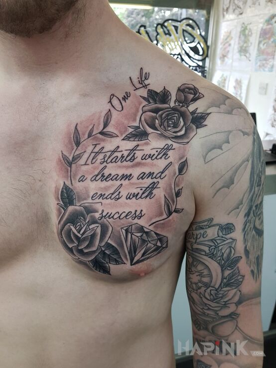 Tattoo Jedno życie in black and gray motif and calligraphy style on the chest