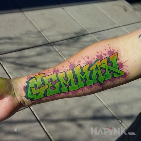 Tattoo Czytelne graffiti in lettering motif and graffiti style on the forearm