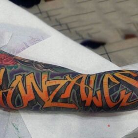 Tattoo Gonzales on the upper arm motif: lettering style: graffiti