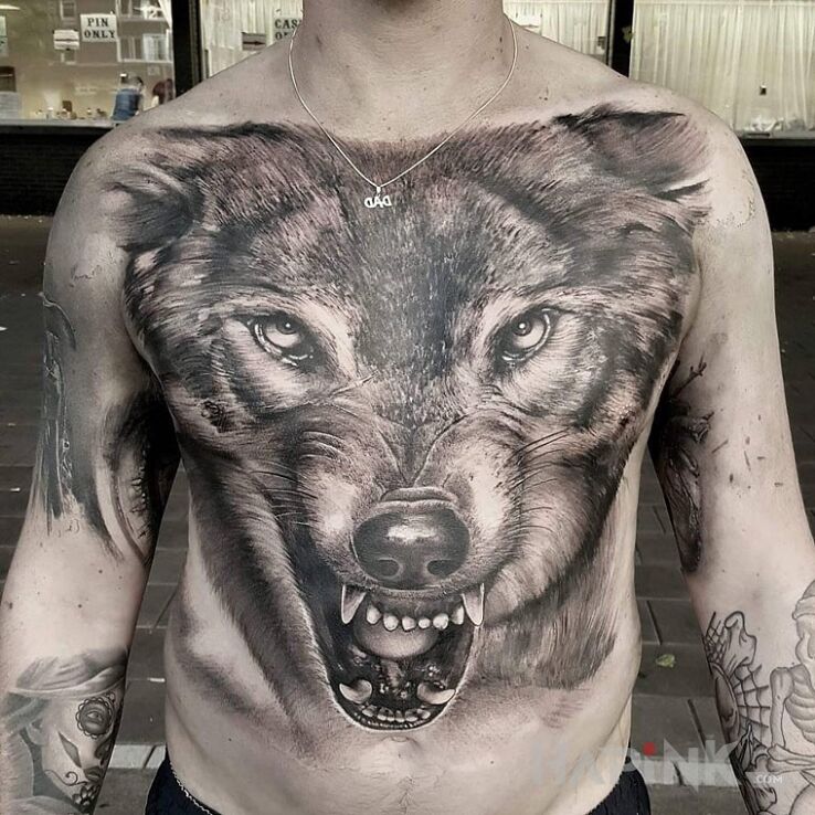 Tattoo Groźny wilk in animals motif and realistic style on the chest