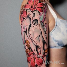 Tattoo Unicorn / Skull on the upper arm motif: skulls style: neo-traditional
