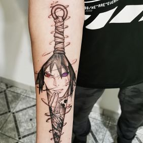 Tattoo Manga Anime Uchiha on the forearm motif: black and gray style: graphic / illustrative