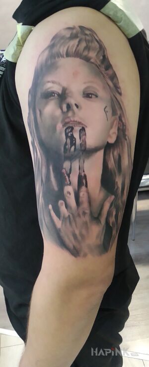 Tattoo Lagertha in black and gray motif and realistic style on the upper arm