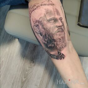 Tattoo Ragnar - Vikings on the calf motif: faces style: realistic