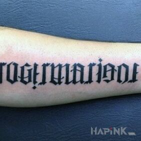 Tattoo Who will read? on the forearm motif: lettering style: ambigrams