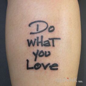 Tattoo Do what you love on the forearm motif: lettering