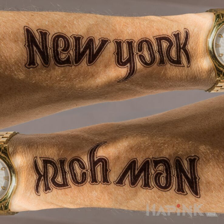 Tattoo New York / Rich Man in lettering motif and ambigrams style on the forearm