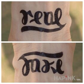 Tattoo Real / fake on the wrist motif: lettering style: ambigrams