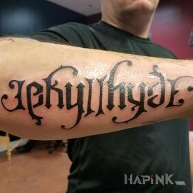 Tattoo Dr Jekyll / Mr Hyde on the forearm motif: lettering style: ambigrams