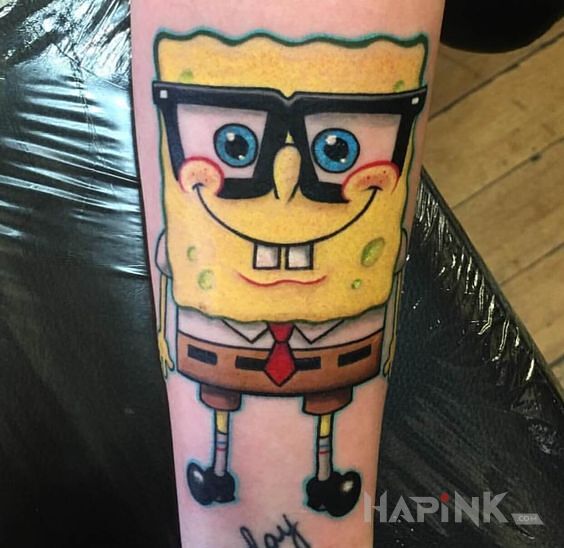 Tattoo Spongebob w okularach in colorful motif and cartoon / comic book style on the forearm