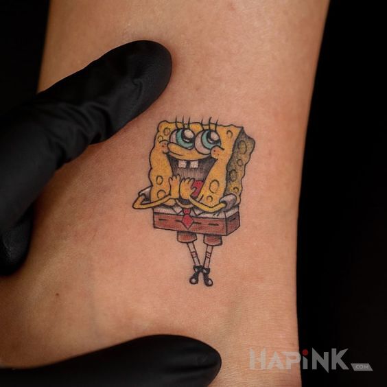 Tattoo Słodziutki malec in colorful motif and cartoon / comic book style near the ankle