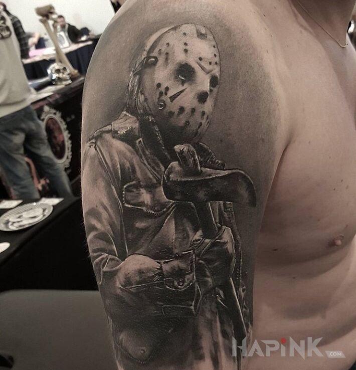 Tattoo Piatek 13 in characters motif and realistic style on the upper arm
