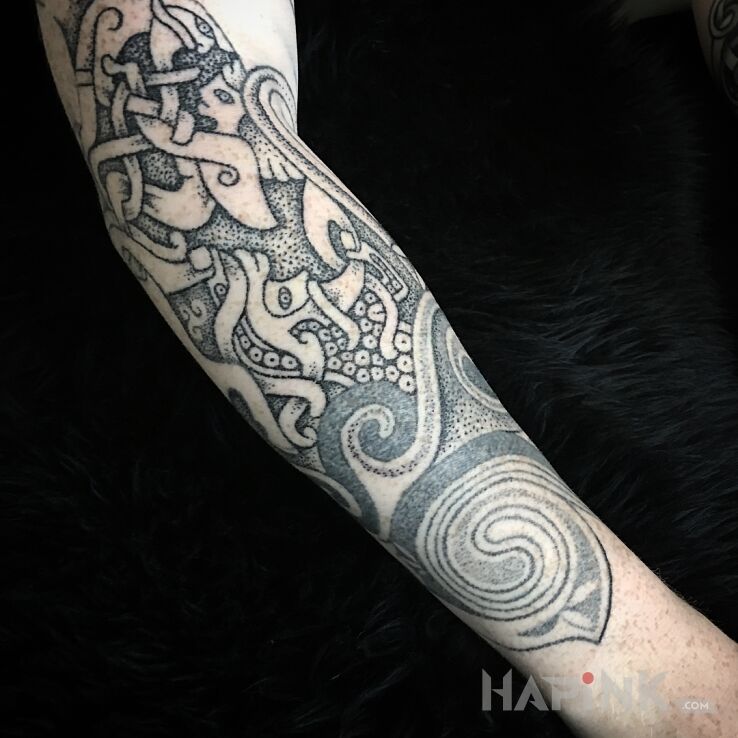 Tattoo Tatuaż celtic in characters motif and dotwork style on the forearm