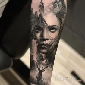Tattoo Girl with a deer on the forearm motif: black and gray style: realistic