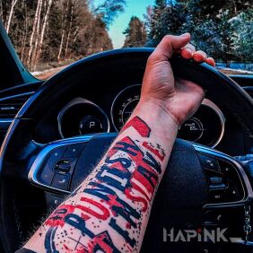 Tattoo Punish and enslave on the forearm motif: lettering style: trash polka