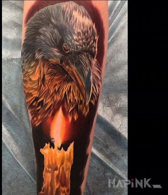 Tattoo Kruk i swieca in 3D motif and realistic style on the forearm