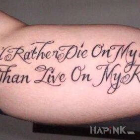 Tattoo Standing on feet on the upper arm motif: lettering style: calligraphy
