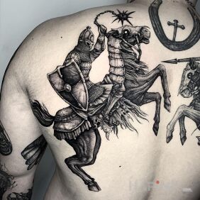 Tattoo Rider on the shoulder blades motif: animals style: graphic / illustrative