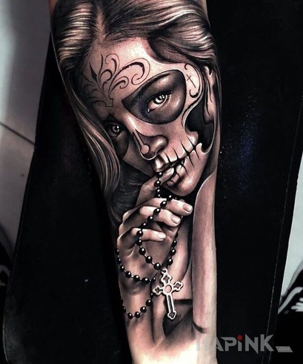 Tattoo Makijaż śmierci in faces motif and realistic style on the forearm