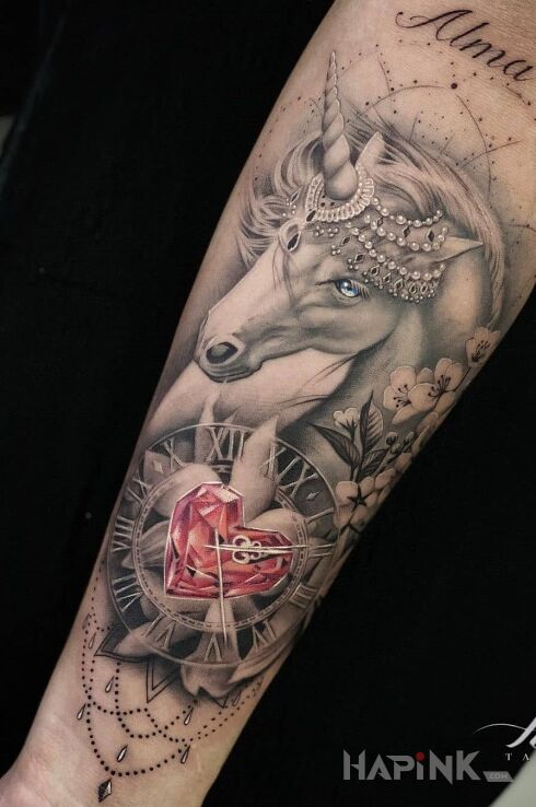 Tattoo Jednorożec w koronie in objects motif and realistic style on the forearm