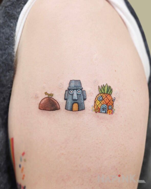 Tattoo Domy trzech przyjaciół in other motif and cartoon / comic book style on the upper arm