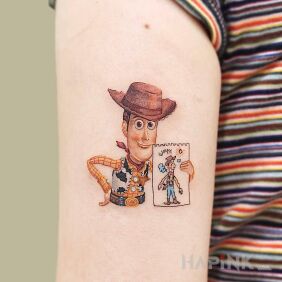 Tattoo Slinky from Toy Story on the upper arm motif: characters style: cartoon / comic book