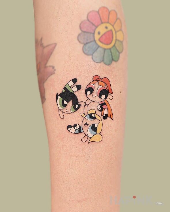 Tattoo Atomówki w komplecie in colorful motif and cartoon / comic book style on the forearm