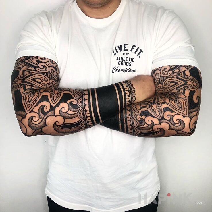 Tattoo Fale na przedramionach in black and gray motif and graphic / illustrative style on the upper arm