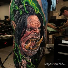 Tatuaż World of Warcraft na nodze motyw: twarze styl: realistyczne