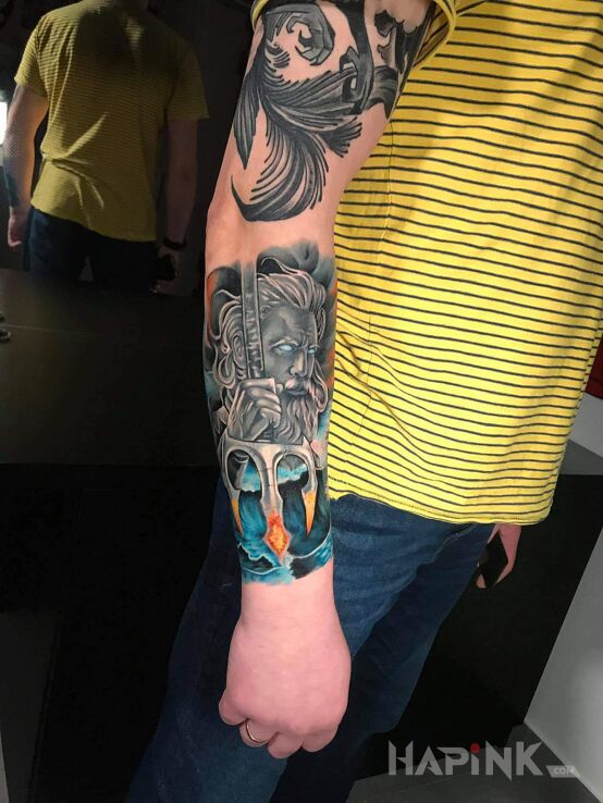 Tattoo Posejdon in characters motif and realistic style on the forearm