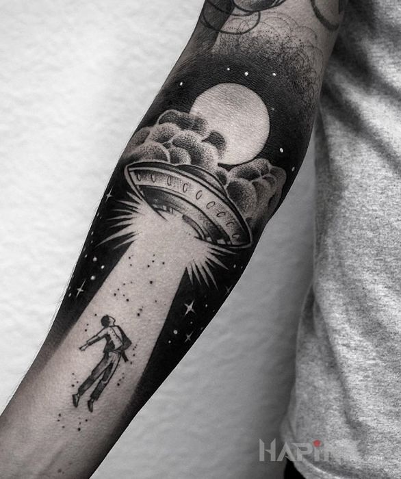 Tattoo Statek ufo in characters motif and graphic / illustrative style on the forearm