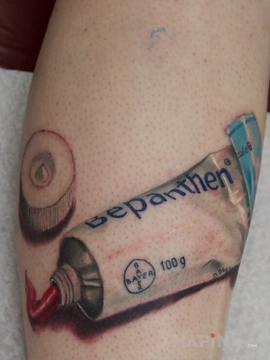 Tattoo Bepanthen in objects motif and realistic style on the forearm