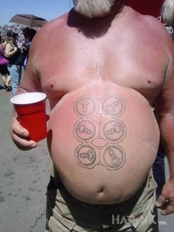 Tattoo 6-pak in objects motif and graphic / illustrative style on the stomach