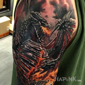 Tattoo Fire dragon on the upper arm motif: fantasy style: realistic