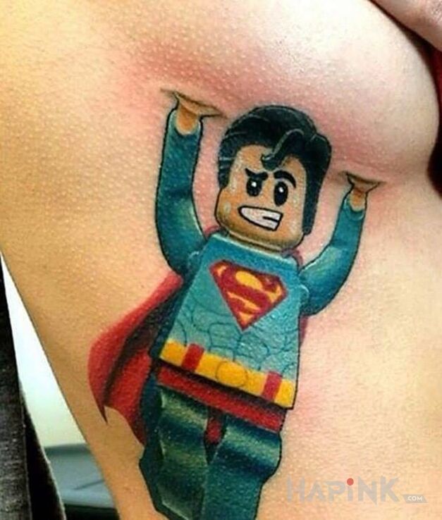 Tattoo Superman i cycek in colorful motif and cartoon / comic book style on the ribs