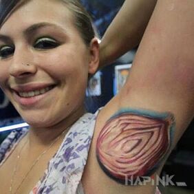 Tattoo Onion on the upper arm motif: colorful style: realistic