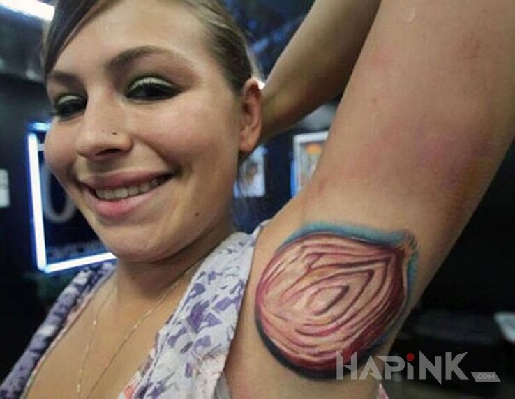Tattoo Cebula in colorful motif and realistic style on the upper arm