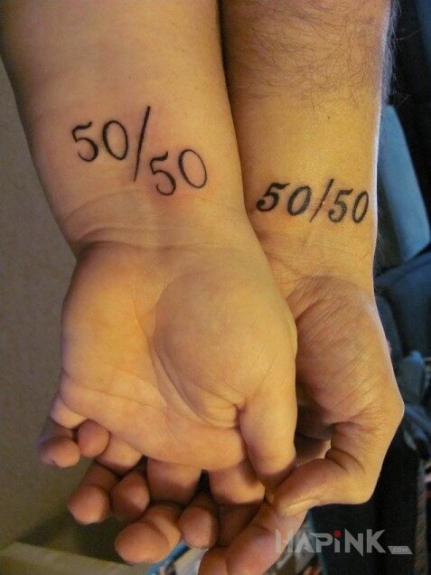 Tattoo 50/50 in Love motif on the wrist