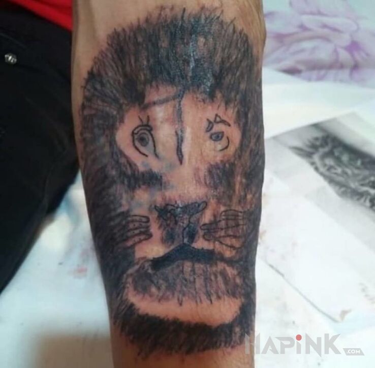 Tattoo Lew yyyyy in animals motif on the forearm