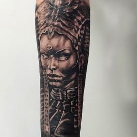 Tattoo Ancient Egypt Goddess on the forearm motif: black and gray style: realistic