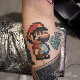 Tattoo Mariano on the forearm motif: pixelated