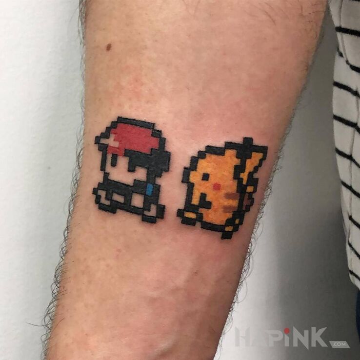 Tattoo Pokemon in pixelated motif on the forearm