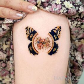 Tattoo Patterned butterfly on the forearm motif: butterflies style: graphic / illustrative
