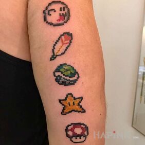 Tattoo A few icons on the upper arm motif: pixelated
