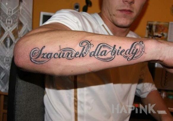 Tattoo Szacunek dla biedy in lettering motif on the forearm