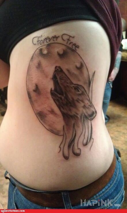 Tattoo Na zawsze wolny in failed motif on the ribs